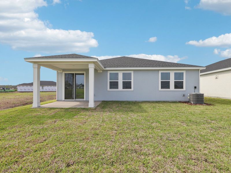 Exterior details and patio area of a home in Lakes at Bella Lago - Signature Series, Green Cove Springs (Image 3).