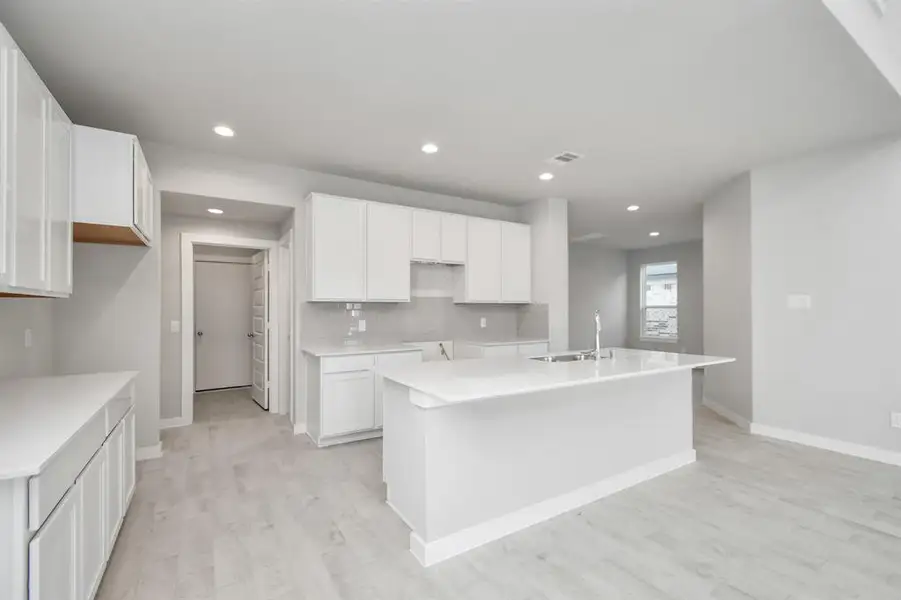 This generously spacious kitchen is a dream realized! Sample photo of completed home with similar floor plan. As-built interior colors and selections may vary.