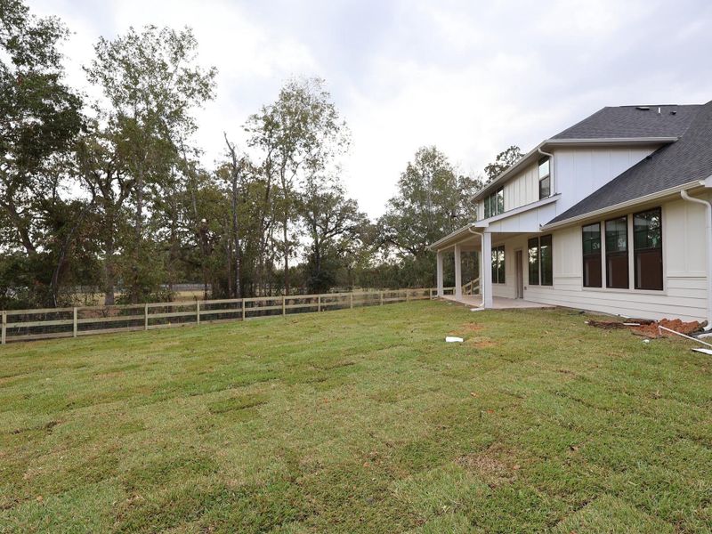 Exterior details and patio area of a home in The Oaks on 6th Street, Magnolia (Image 17). Exterior details and patio area of a home in The Oaks on 6th Street, Magnolia (Image 17).