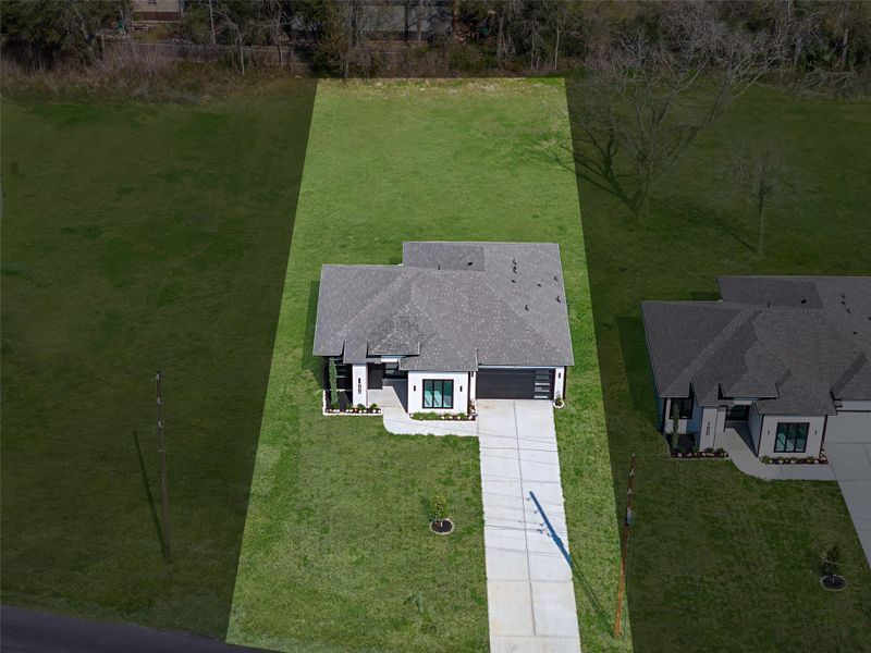 Front exterior of a new home in , Dayton, TX, highlighting curb appeal (Image 24).