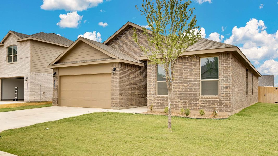 Front exterior of a new home in Viridian, Lubbock, TX, highlighting curb appeal (Image 15).