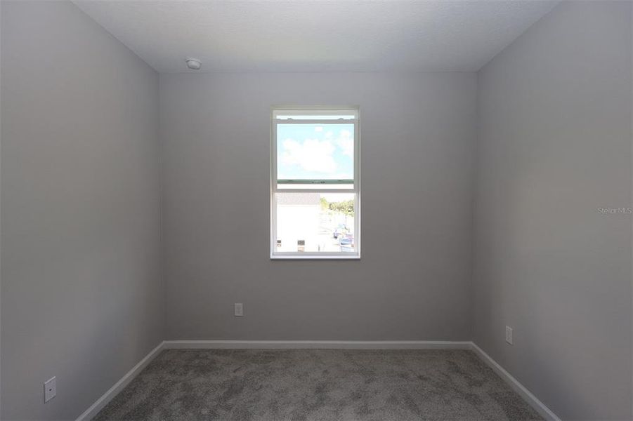 Spacious, unfurnished interior of a new home in Tribute at Ovation, Winter Garden (Image 10).