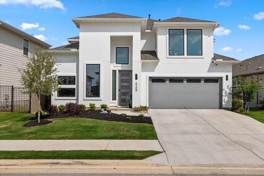 Front exterior of a new home in Easton Park, Austin, TX, highlighting curb appeal (Image 1). Front exterior of a new home in Easton Park, Austin, TX, highlighting curb appeal (Image 1).