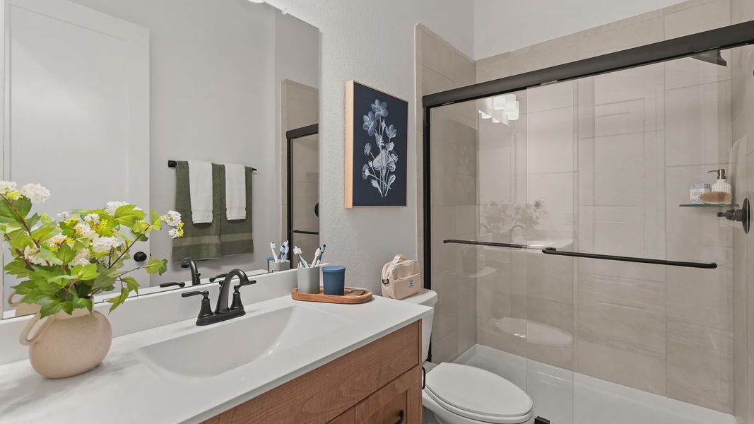 Representative furnished interior of a home built from the Hillcrest by Chesmar Homes in Artavia, Conroe (Image 15).