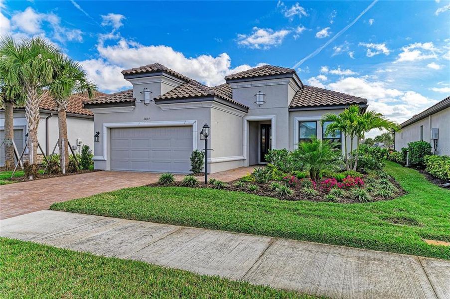 Front exterior of a new home in , Sarasota, FL, highlighting curb appeal (Image 22). Front exterior of a new home in , Sarasota, FL, highlighting curb appeal (Image 22).