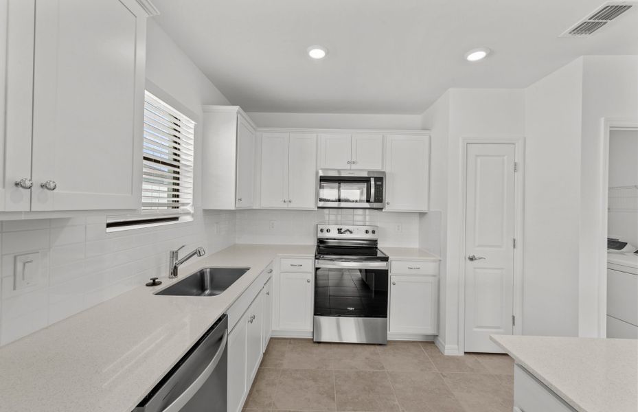 Furnished interior view inside a new home in Whispering Lakes, Lehigh Acres (Image 11).