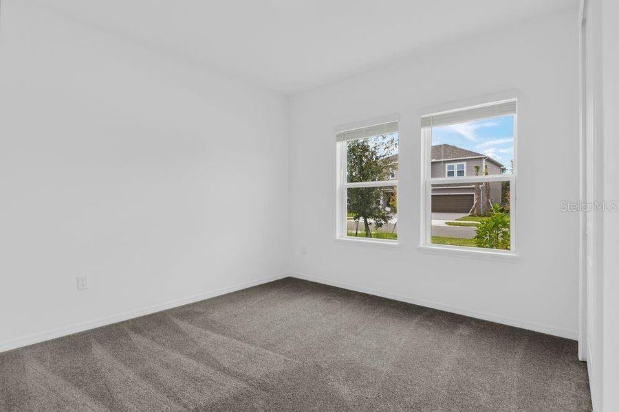 Spacious, unfurnished interior of a new home in Ardisia Park, New Smyrna Beach (Image 39).