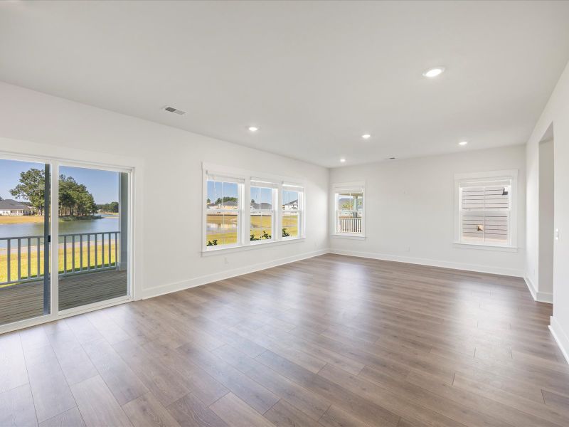 Spacious, unfurnished interior of a new home in The Coves at Lakes of Cane Bay, Summerville (Image 17).