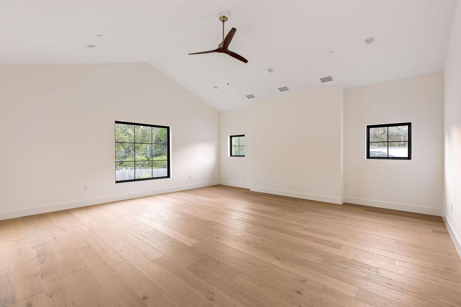 Custom cabinetry and built-in bench offer refined storage within this sophisticated space.