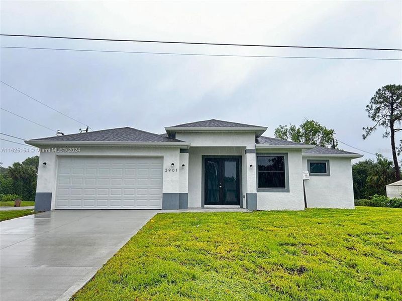 Front exterior of a new home in , Lehigh Acres, FL, highlighting curb appeal (Image 10). Front exterior of a new home in , Lehigh Acres, FL, highlighting curb appeal (Image 10).