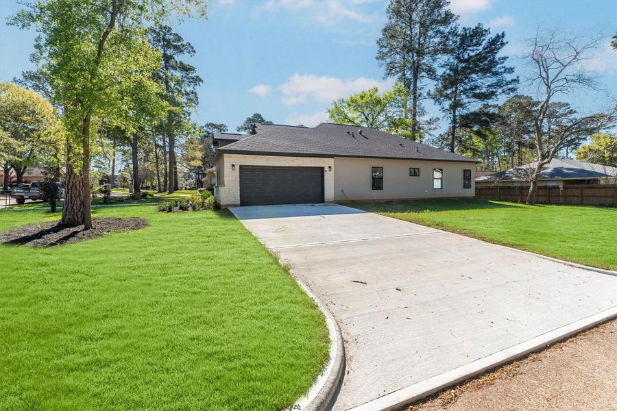 Front exterior of a new home in , Montgomery, TX, highlighting curb appeal (Image 26).