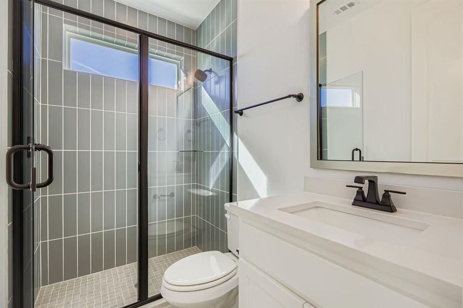 Full bathroom featuring vanity and a shower stall Full bathroom featuring vanity and a shower stall
