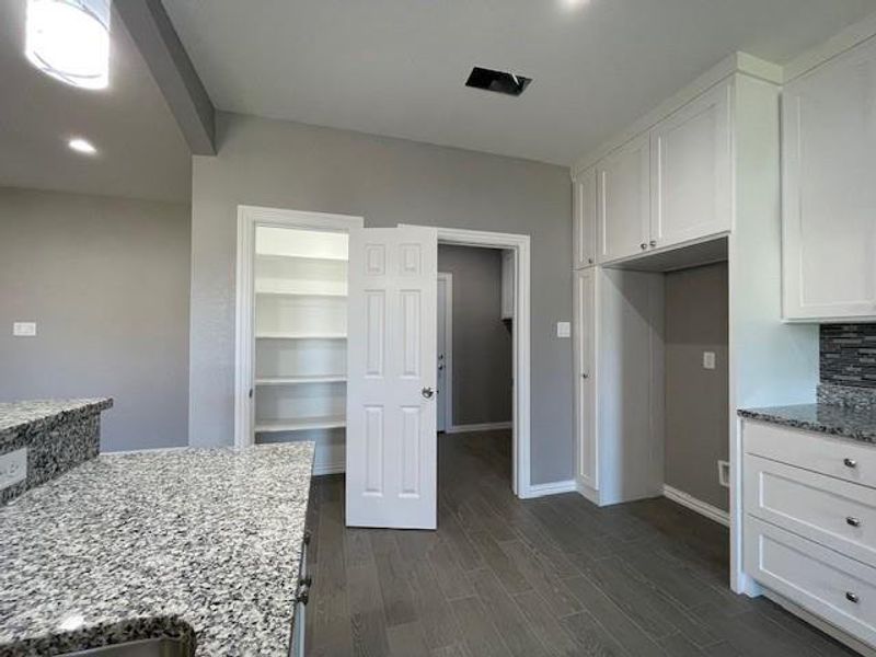 Kitchen showing pantry with automatic lighting Kitchen showing pantry with automatic lighting