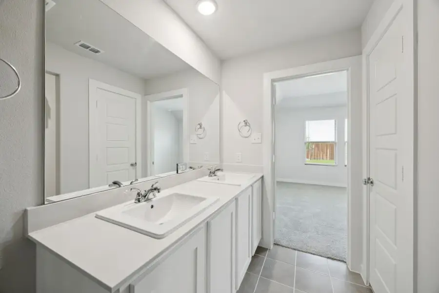 Primary Bathroom in the Hadley home plan by Trophy Signature Homes – REPRESENTATIVE PHOTO