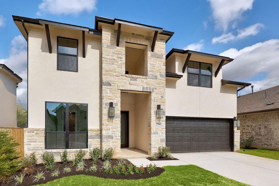 Front exterior of a new home in The Colony, Bastrop, TX, highlighting curb appeal (Image 23). Front exterior of a new home in The Colony, Bastrop, TX, highlighting curb appeal (Image 23).