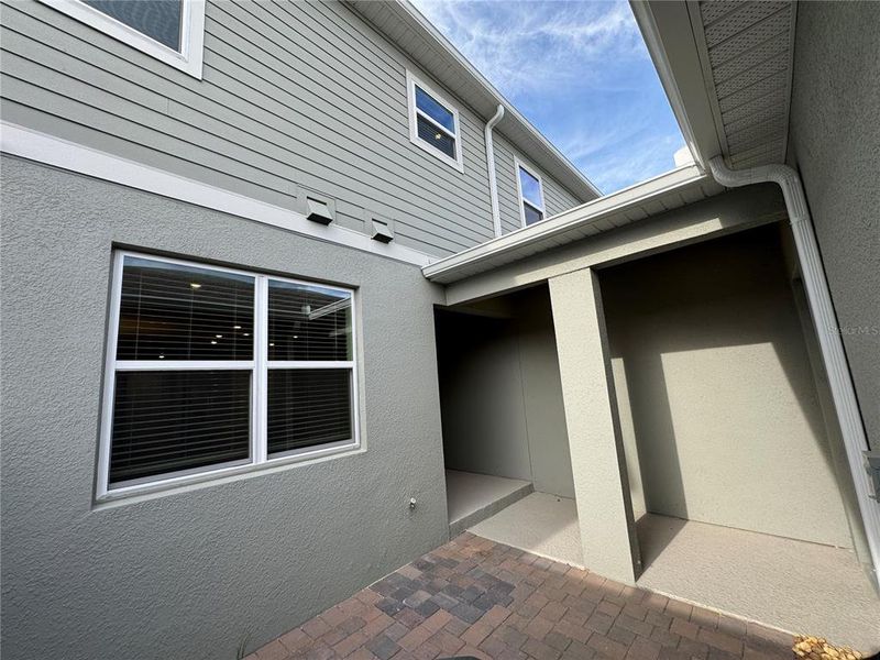 Exterior details and patio area of a home in Hamlin Ridge, Winter Garden (Image 19).