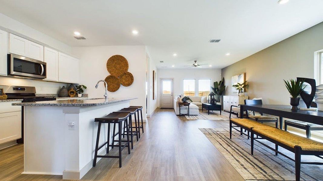 Representative furnished interior of a home built from the The Pierce by D.R. Horton in Overlook West, Wolfforth (Image 5).