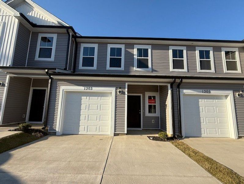 Front exterior of a new home in Caroleton Townhomes, Grovetown, GA, highlighting curb appeal (Image 1).