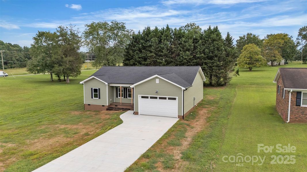 Front exterior of a new home in , Statesville, NC, highlighting curb appeal (Image 23).
