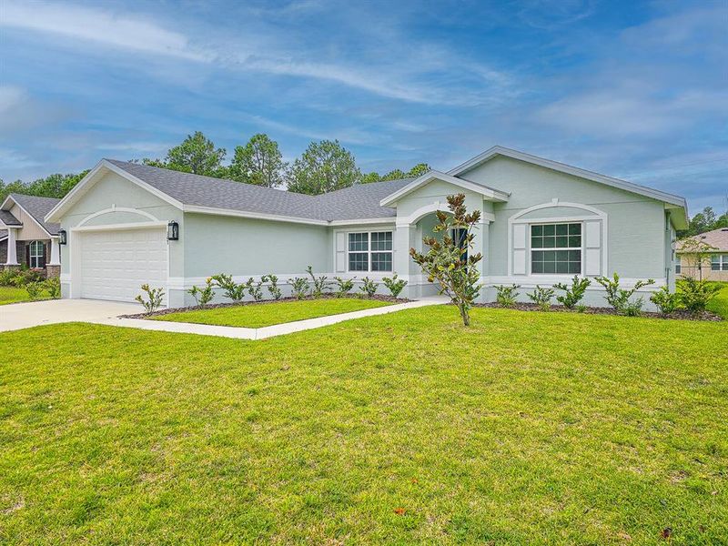 Front exterior of a new home in , Palm Coast, FL, highlighting curb appeal (Image 22).