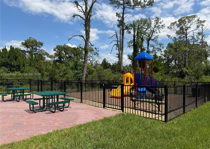 Playground with seating area for residents’ comfort and convenience.