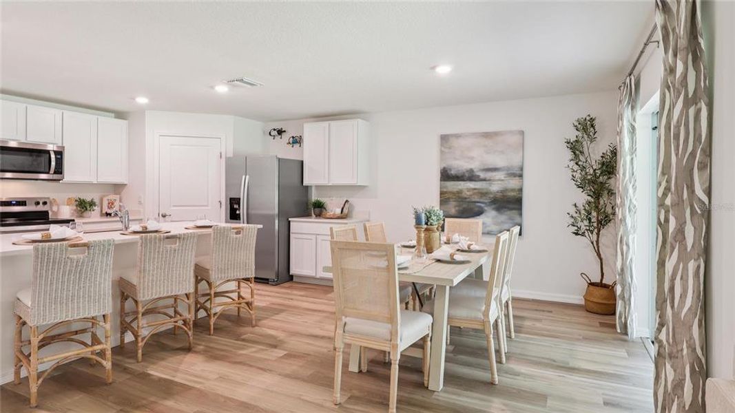 Furnished interior view inside a new home in Triumph South, Wildwood (Image 12).