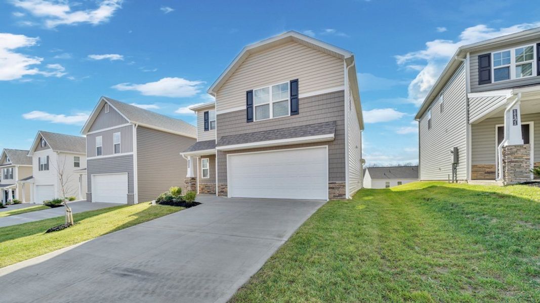 Front exterior of a new home in Johnson Farms, Greeneville, TN, highlighting curb appeal (Image 17). Front exterior of a new home in Johnson Farms, Greeneville, TN, highlighting curb appeal (Image 17).