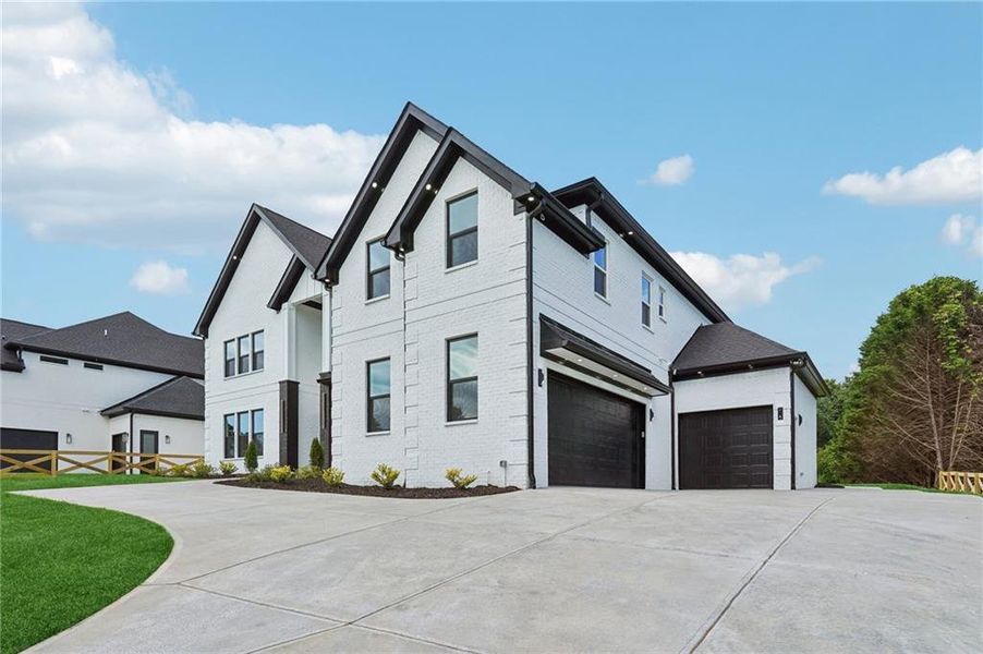 Front exterior of a new home in , Braselton, GA, highlighting curb appeal (Image 21). Front exterior of a new home in , Braselton, GA, highlighting curb appeal (Image 21).