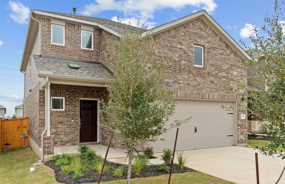 Front exterior of a new home in Crosswinds, Kyle, TX, highlighting curb appeal (Image 17).
