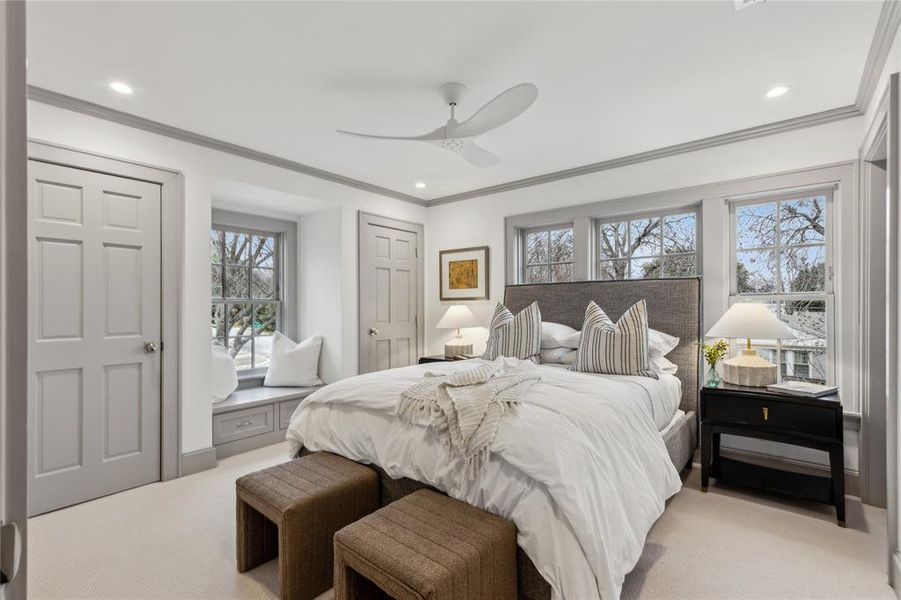 Bedroom with light carpet, ceiling fan, ornamental molding, and recessed lighting