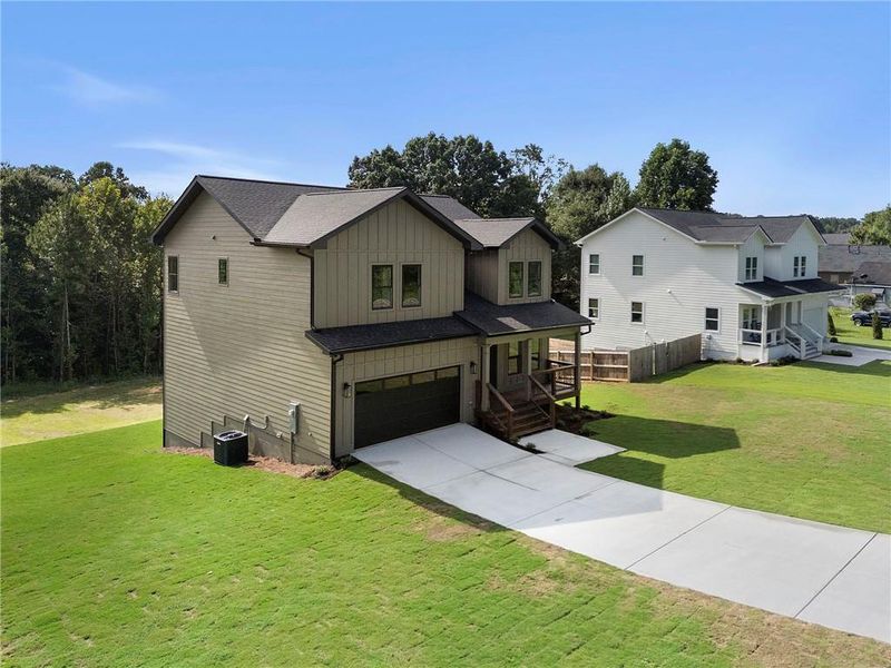 Front exterior of a new home in , Hiram, GA, highlighting curb appeal (Image 26).
