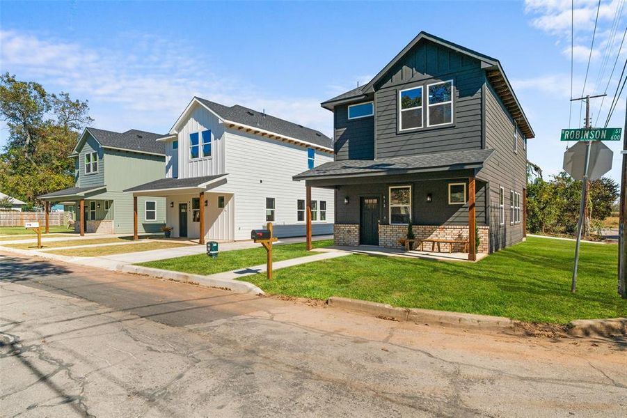 Front exterior of a new home in , Cleburne, TX, highlighting curb appeal (Image 24).