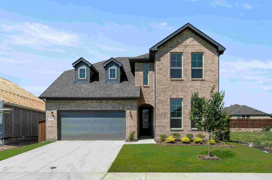 Front exterior of a new home in The Oaks, Red Oak, TX, highlighting curb appeal (Image 1).