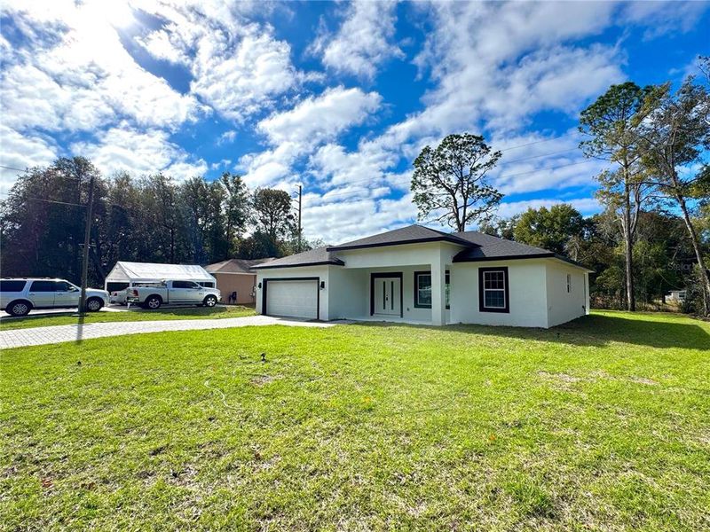 Exterior details and patio area of a home in , Citrus Springs (Image 22).
