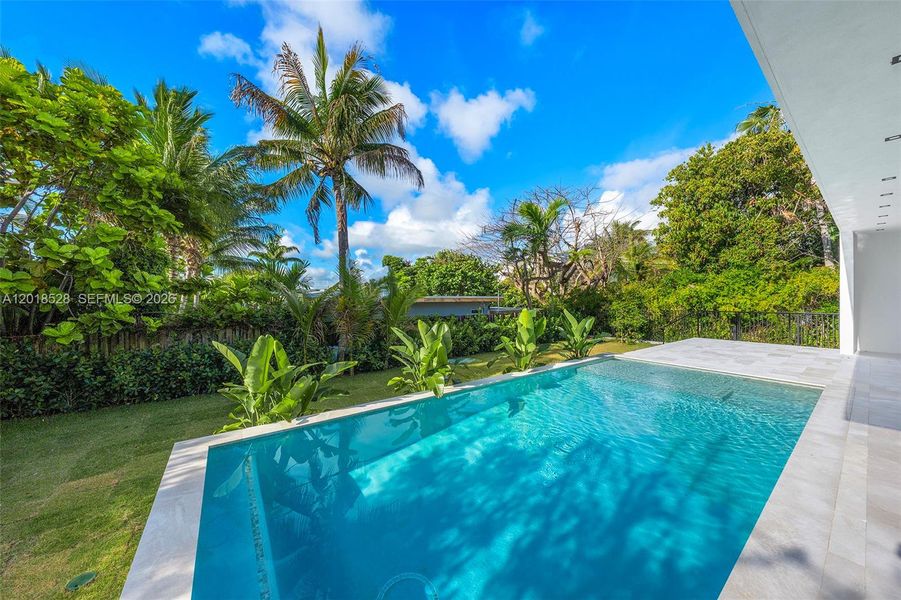 Exterior details and patio area of a home in , North Miami (Image 3).