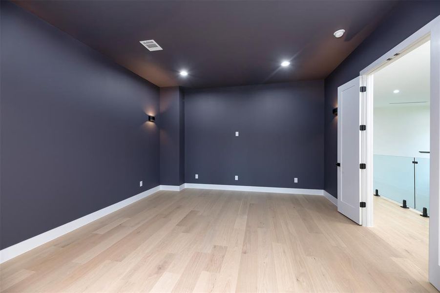 Empty room with recessed lighting and light wood-style flooring Empty room with recessed lighting and light wood-style flooring