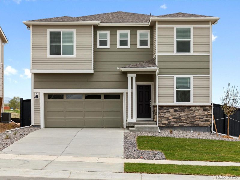 Front exterior of a new home in Westgate, Greeley, CO, highlighting curb appeal (Image 23). Front exterior of a new home in Westgate, Greeley, CO, highlighting curb appeal (Image 23).