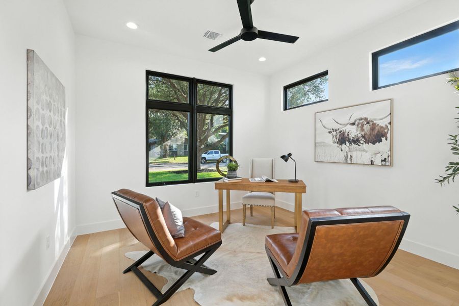 Home office featuring recessed lighting, light wood finished floors, and a ceiling fan Home office featuring recessed lighting, light wood finished floors, and a ceiling fan