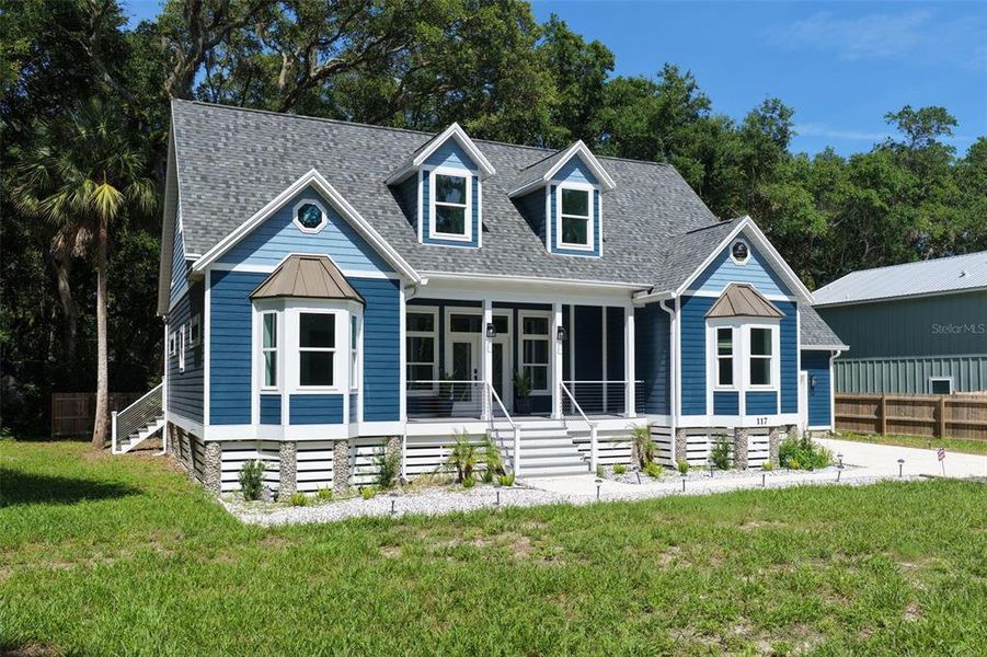 Front exterior of a new home in , Palm Coast, FL, highlighting curb appeal (Image 26). Front exterior of a new home in , Palm Coast, FL, highlighting curb appeal (Image 26).