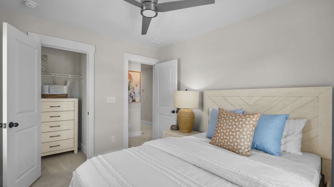 Secondary bedroom with 2 large windows on single wall in a DRB Homes Brookgreen model home Secondary bedroom with 2 large windows on single wall in a DRB Homes Brookgreen model home