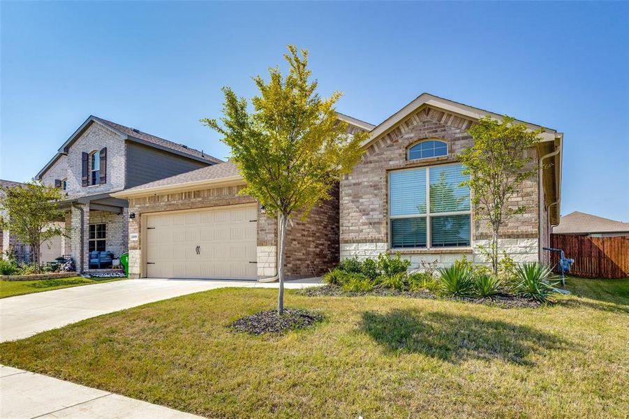 Front exterior of a new home in , Haslet, TX, highlighting curb appeal (Image 1). Front exterior of a new home in , Haslet, TX, highlighting curb appeal (Image 1).
