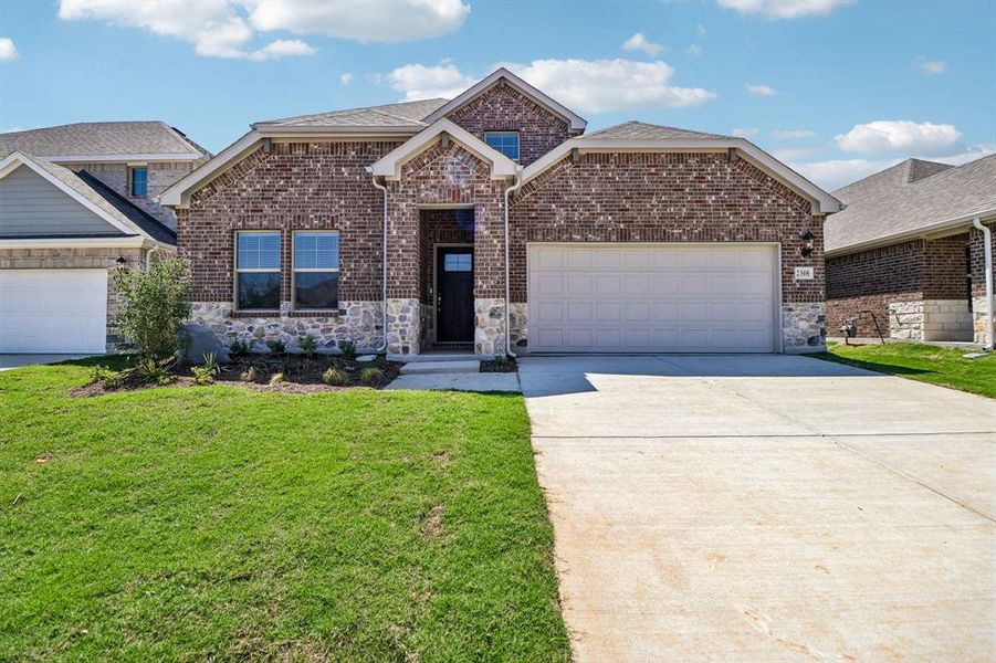 Front exterior of a new home in Stella Hills, Denton, TX, highlighting curb appeal (Image 1). Front exterior of a new home in Stella Hills, Denton, TX, highlighting curb appeal (Image 1).