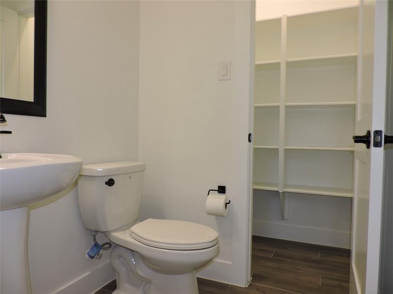 Half bath downstairs at Family room area. Wonderful large storage closet inside.