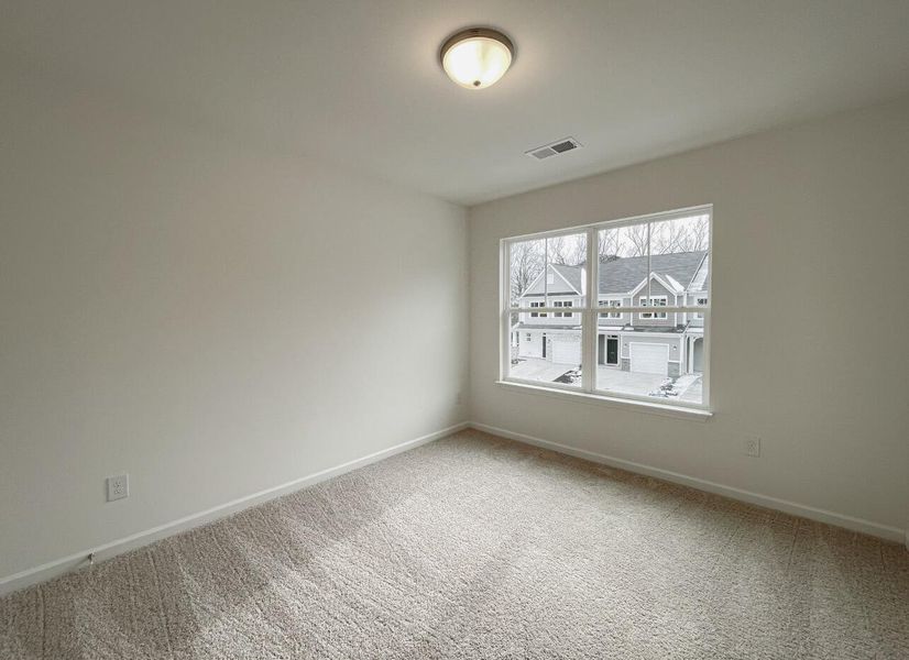 Spacious, unfurnished interior of a new home in East Main Townes, Spartanburg (Image 19).