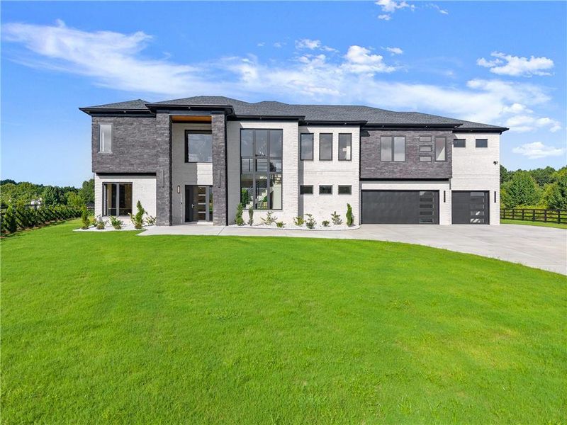 Front exterior of a new home in , Dacula, GA, highlighting curb appeal (Image 1).