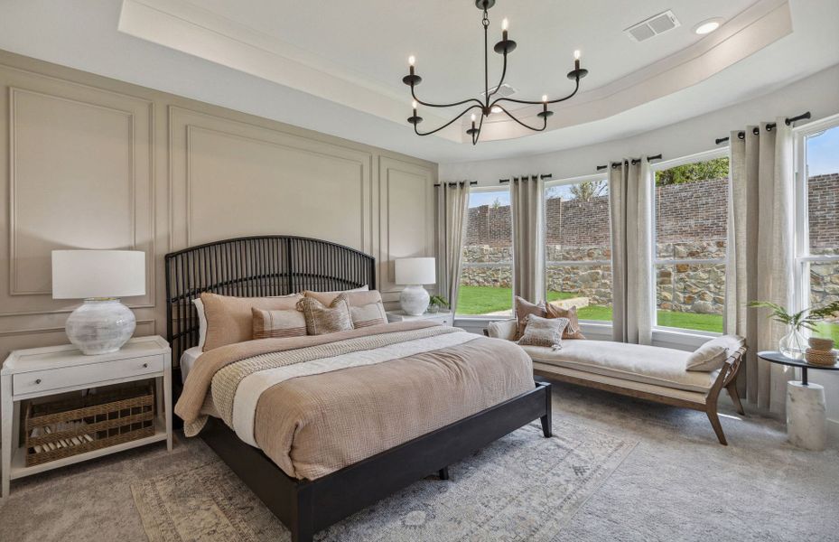 Owner's Bedroom with a Tray Ceiling and Bay Windows