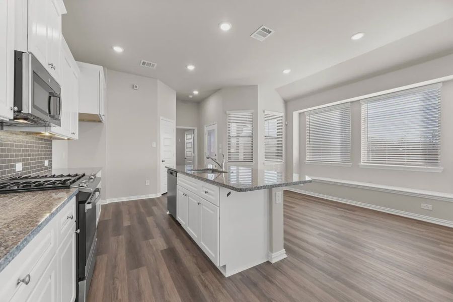 Representative furnished interior of a home built from the Charleston by Chesmar Homes in Avondale, Fate (Image 4).