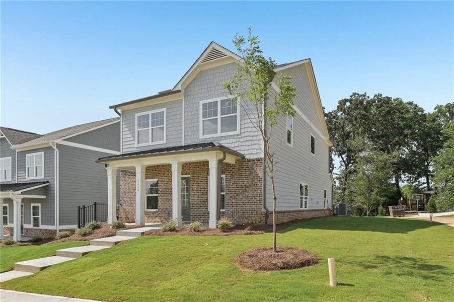 Front exterior of a new home in Magnolia Trace, Flowery Branch, GA, highlighting curb appeal (Image 14).