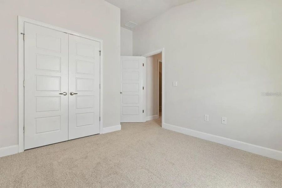 Representative unfurnished interior of a home built from the 1512 by Adams Homes in Winding Oaks, Weeki Wachee (Image 12).