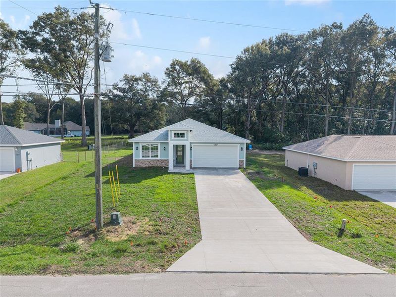 Front exterior of a new home in , Summerfield, FL, highlighting curb appeal (Image 2). Front exterior of a new home in , Summerfield, FL, highlighting curb appeal (Image 2).